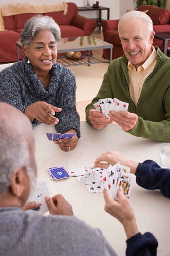 Group of elderly people playing cards