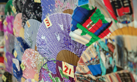 image of a variety of colorful paper fans